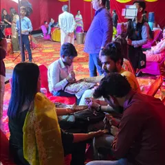 My team is hard at work applying mehandi for guests at a wedding. We ensure that every guest gets a beautiful design to be part of the celebration.