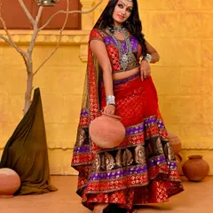 A full-length shot from our Rajasthani folk series. The set was designed to evoke a desert village scene, and the model's pose with the earthen pot completes the authentic, story-driven concept.