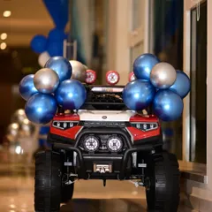 Make a grand entrance! I offer rental toy cars, like this red and black jeep, for the birthday child to ride into their party in style.