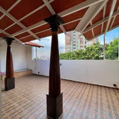 For this terrace, we used traditional design elements like clay tiles and carved wooden pillars to create a shaded seating area. It's a peaceful, semi-open space that offers a great view and protection from the elements.