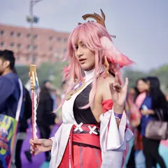 A cosplayer strikes a pose in the middle of the event grounds. I capture both posed portraits and candid moments to tell the full story of the convention.
