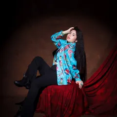 And it goes like this. A confident, relaxed pose in a quirky and colorful shirt, perfect for showcasing personality.