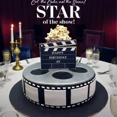 The star of the show! This movie-themed cake is designed as a film reel with a clapperboard on top, complete with edible popcorn. It's the perfect cake for a movie buff's birthday party.