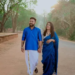 A romantic walk down a country lane, hand in hand. The soft morning light and traditional outfits give this pre-wedding photo a timeless feel.