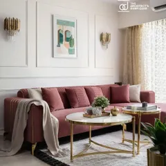 This feature highlights the custom pink L-shaped sofa and classic wall paneling, which create an elegant and welcoming ambiance in the living room.