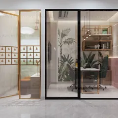 The boss's cabin, featuring a tropical-themed wallpaper and glass partitions that maintain a sense of openness while ensuring privacy.