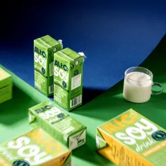 A geometric and abstract composition for Alt Co. Soy Drink. The use of strong lines, contrasting blue and green colors, and dramatic shadows results in a highly stylized and modern product shot.
