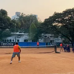 Players competing in a doubles match during the Tennis Temple Premier League (TTPL) in December 2022. Our leagues are a great way to find competitive matches.