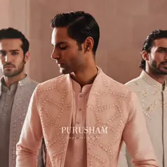 Draped in the gentle hues of elegance. This trio showcases different styles from my 'Takht' collection, with coordinated jackets in pastel pink and grey, perfect for the groom's closest friends.