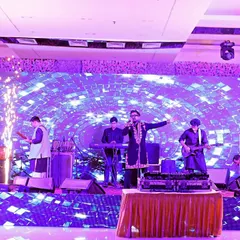 A live band performing at a Diwali party. The stage lights and energetic performance create a fantastic atmosphere, and I make sure to capture the entertainment that makes an event special.