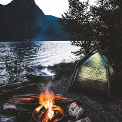 An evening at one of my favorite lakeside campsites. The setup is simple: a warm tent, a fire to keep you company, and a canoe ready for a quiet paddle on the water. This is what I mean by hitting the reset button.