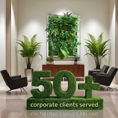 Trust is built on a track record of execution. Serving over 50 corporate clients is a testament to our ability to deliver strategic landscaping solutions that meet complex business objectives. This image from a client's lobby, featuring a vertical garden and topiary, represents our commitment to integrating brand identity with high-performance biophilic design.