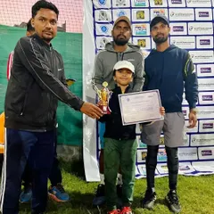 A triple win for our young champion, Aariv. He is seen here receiving one of his three trophies won in a single day, a testament to his growing skill and the effectiveness of our junior development program.