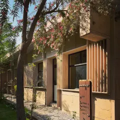 The guard rooms for a residential complex. Even in small, functional structures, we focus on material quality and thoughtful design, using sandstone and wooden louvers to create a welcoming entrance.
