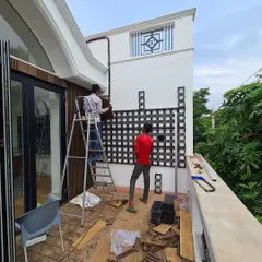 Here, you can see my team beginning the installation. We are carefully mounting the interlocking grid panels that will form the base structure of the vertical garden, ensuring it is secure and perfectly aligned.