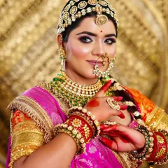 The elegance of a traditional bride. This pose highlights the detailed hand and arm jewelry, along with the flawless makeup application.