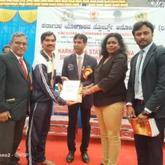 Receiving the gold medal at the Karnataka State Level Yogasana Competition in 2022. Consistent performance at the state level is the foundation for national aspirations.