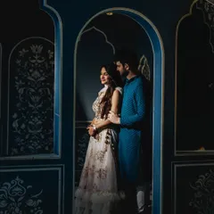 I love playing with light and shadow, as seen in this dramatic portrait inside a heritage property. The deep blue walls and the focused light create a moody, artistic image that feels both royal and intimate.