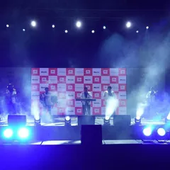 Creating an electric atmosphere for a live music performance at a corporate brand event. Our stage lighting design uses dynamic beams and atmospheric smoke to immerse the audience and put the artists in the spotlight.