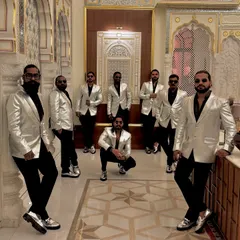 Ready to make the beats drop. The crew looking sharp in silver and black, ready for a night of performance.
