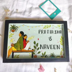 A personalized nameplate featuring a custom illustration of the couple. We love creating these unique pieces that capture a bit of our clients' personality and story.