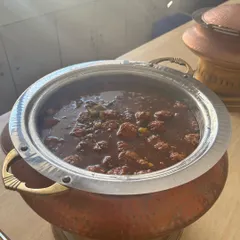A close-up of the Gobi Manchurian served in a traditional copper pot for a school lunch event. My Indo-Chinese dishes are always a hit, adding a popular flavor profile to any corporate or institutional menu.