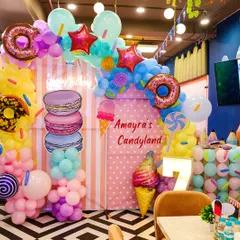 We brought a child's sweet dream to life with this incredible "Candyland" theme. Featuring giant macarons, ice cream cones, and donut balloon arches, our themed party decorations transform the space into a whimsical paradise.