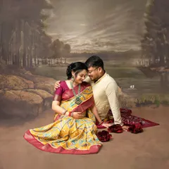 A romantic couple's portrait with a painted backdrop. The traditional attire and classic pose create a feeling of a timeless love story.