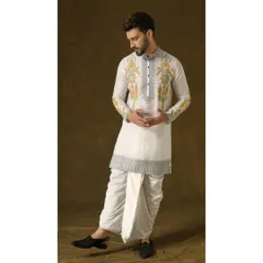 The Narayan Nirvana dhoti set. This ivory organza kurta is meticulously crafted with silver embroidery and vibrant pops of color, paired with a classic dhoti for timeless elegance.