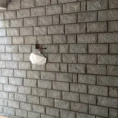 This is an example of wall cladding using uniform, brick-shaped stones. It gives a more organized, yet still natural, look to the wall.