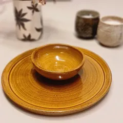 I am happy to announce my special Rakhi edit gift hampers. This set, featuring a beautiful mustard-colored bowl and plate, is a truly special handmade gift for your loved ones.