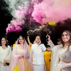 A burst of color and celebration! The use of colored smoke makes for a dramatic and joyful entrance, a moment of pure fun that I love to capture.