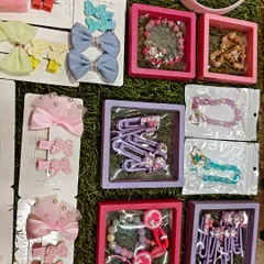 Here are some of my boxed accessory sets, perfect for gifting. You can see different styles of bracelets and hair clips with cute characters, all ready to be gifted.