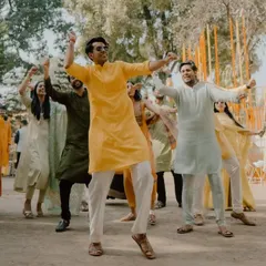 The whole family dancing together at an outdoor mehendi ceremony. We choreograph flash mobs and group dances for all wedding events.