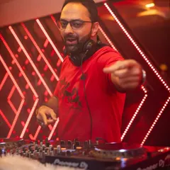 A classic shot of me connecting with the crowd. I'm always watching the dance floor, pointing people out, and making sure the vibe is just right for a blockbuster Holly-Bollywood night.
