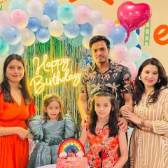 Family and friends gather for a photo at a 4th birthday party. Our space is designed to bring everyone together.