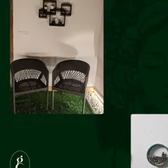 This image shows how I pair functional seating with decorative wall art and planters to create a complete and cohesive look, even in a small corner.