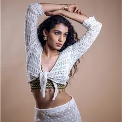 A beautiful shot from a modeling shoot. The makeup is clean and sophisticated, enhancing the model's features without distracting from the styling.