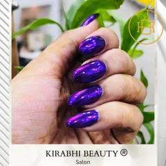 For those who love to make a statement, this metallic purple chrome finish is a showstopper. I apply a special chrome powder over a gel base to get this incredible liquid-metal effect on these almond-shaped extensions.