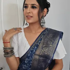 A close-up of my take on a subtle Maharashtrian look. The hair is styled in a simple, elegant bun, paired with oxidized silver jewelry and a bindi.