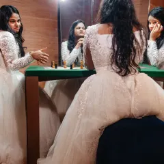 A playful and creative portrait of the bride "playing chess" with her own reflections. Using mirrors, we created this fun, surreal image that showcases her personality in a unique way.