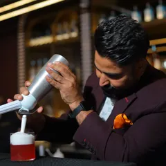 Here I am putting the finishing touches on a drink at That Place Kolkata. As a consultant, I'm deeply involved in training the staff to execute the new menu perfectly.