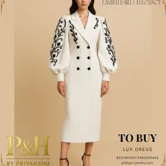 A full-length view of the white embroidered dress, showing how it pairs with black heels for a complete, powerful look. The tailored fit and knee-length cut offer a sophisticated and modern aesthetic.