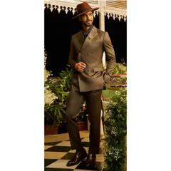 This brown double-breasted suit, paired with a fedora, creates a very dapper and vintage-inspired look. It shows how we can work together to create a complete, stylized ensemble.