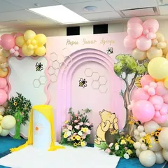 The complete Winnie the Pooh setup, with a soft white rug for the little one, creating a perfect spot for photos.