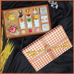 This compact Holi gift box is perfect for corporate giveaways. It includes small bottles of liquid colors, packets of gulal, and other festive essentials in a checkered-print box.