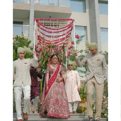 The bride's grand entrance, escorted by her brothers under a beautiful 'phoolon ki chadar'. This is a timeless tradition, and we ensure it's as magical and memorable as it deserves to be.