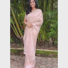 A simple, happy picture in a light pink saree. Sometimes a simple smile is all you need.