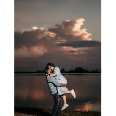 Capturing the pure joy and romance of a golden hour lift against a dramatic sunset sky. These are the moments that feel like they're straight out of a movie.