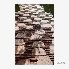 The distinctive stone facade of the Otters Club from 1973. This detail shows a playful yet ordered pattern of projecting stones, creating a dynamic surface of light and shadow that has become an architectural landmark.
